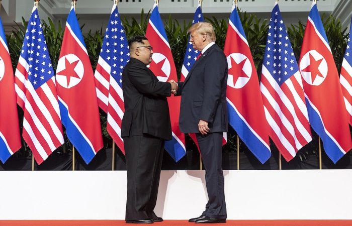 Kim and Trump shaking hands at the red carpet during the DPRK–USA Singapore Summit, June 12, 2018. (Credit: Executive Office of the United States)